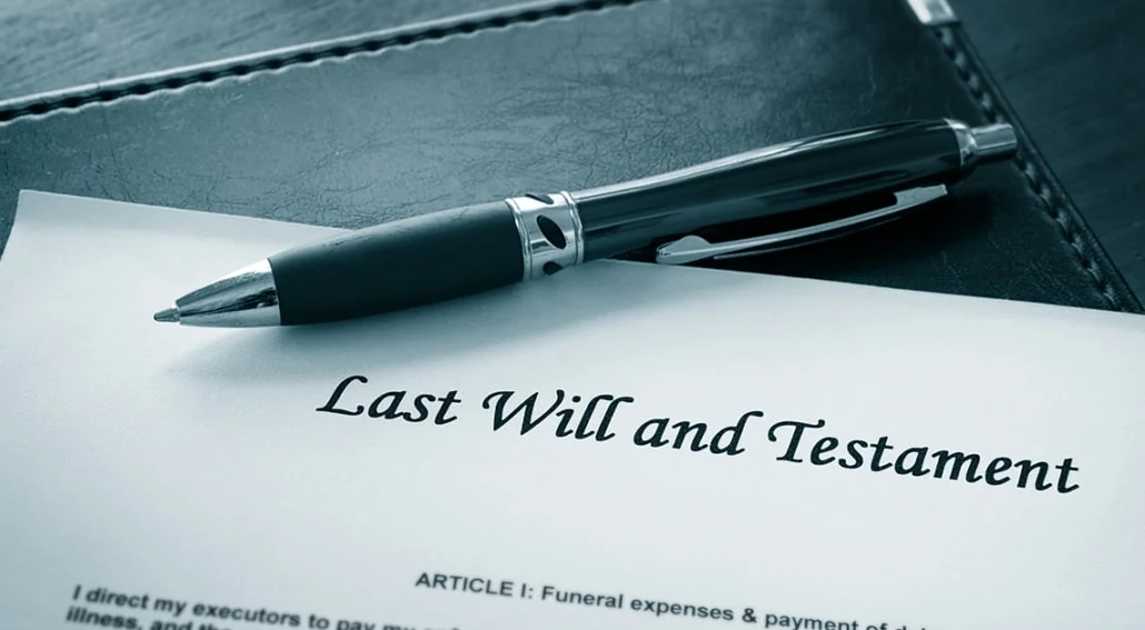 Pet owner reviewing a last will and testament while holding a dog